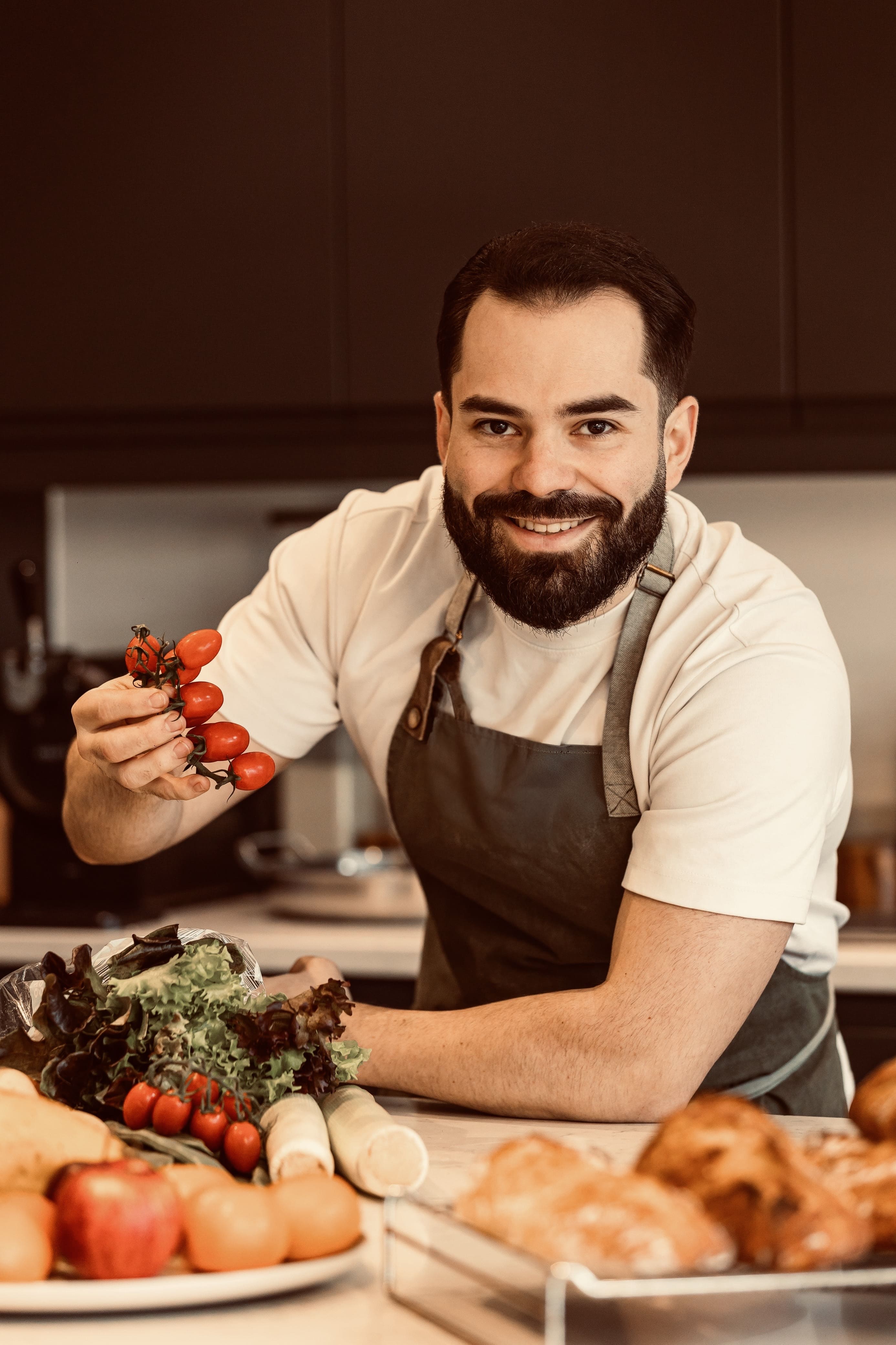 Chef Isi with fresh ingredients